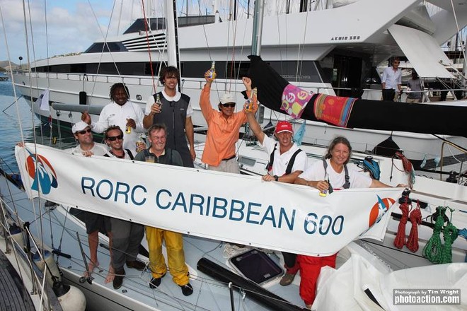 Local hero Bernie Evan Wong’s jubliant crew celebrate their arrival today. Racing the smallest yacht in the fleet, the crew aboard the Mumm 36, High Tension arrives dockside Antigua - RORC Caribbean 600 2012 ©  Tim Wright / Photoaction.com http://www.photoaction.com